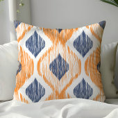 ネイビーブルーとオレンジオギーイカットパターン クッション