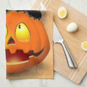 ネコおもしろいハロウィーンキャラクターカボチャをかむ キッチンタオル (四つ折り)