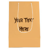 ネコおもしろいハロウィーンキャラクターカボチャをかむ ミディアムペーパーバッグ (裏面)