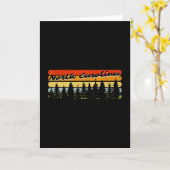 ノースカロライナの森の夕焼けの木小屋テーマの絵 カード (黄色い花)