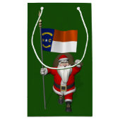 ノースカロライナの看板を持つサンタクロース スモールペーパーバッグ (裏面)