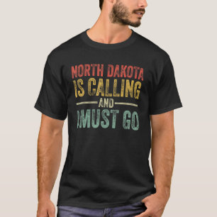ノースダコタが電話してきて、家に帰らなけおもしろいればならない Tシャツ