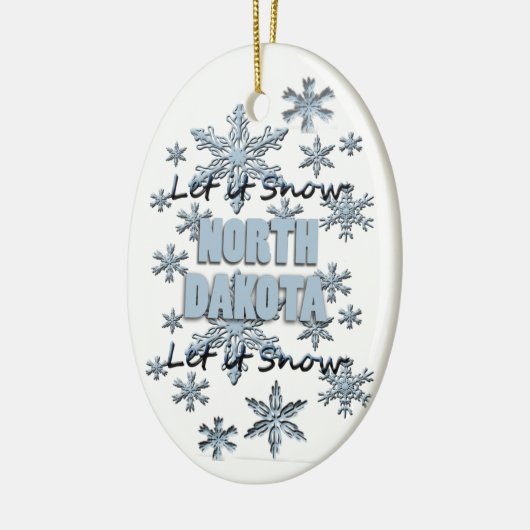 ノースダコタのクリスマス飾りに雪をかける セラミックオーナメント (左)