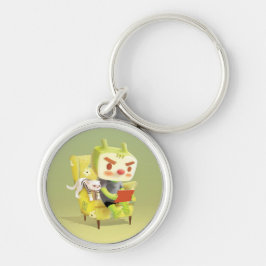 ノートパソコンを肘掛け椅子に座っている少年 キーホルダー