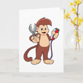 ハサミとカミソリを持った猿の美容師 カード (黄色い花)