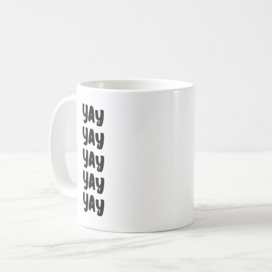 ハッピーアップリフモダンティングポジティヴおもしろいキュイイ コーヒーマグカップ (正面左)