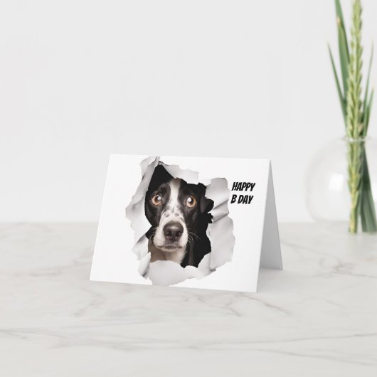 ハッピーバースデー犬が壊れた紙を見る カード (正面)