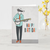 ハッピーバースデー-バンジョーの挨拶車を遊んでいるアナグマ カード (黄色い花)