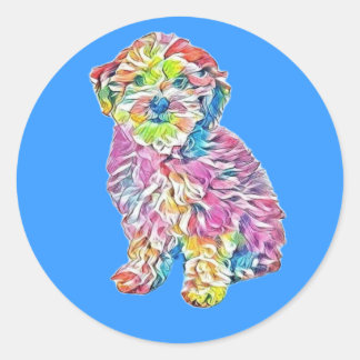 ハバニーズとプードルの交雑種の子犬が再び座っている ラウンドシール