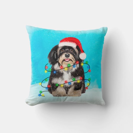 ハバニーズの犬がビーチのクリスマスハットライトに座る クッション (正面)