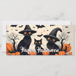 ハロウィンに帽子をかぶった黒猫たち3匹