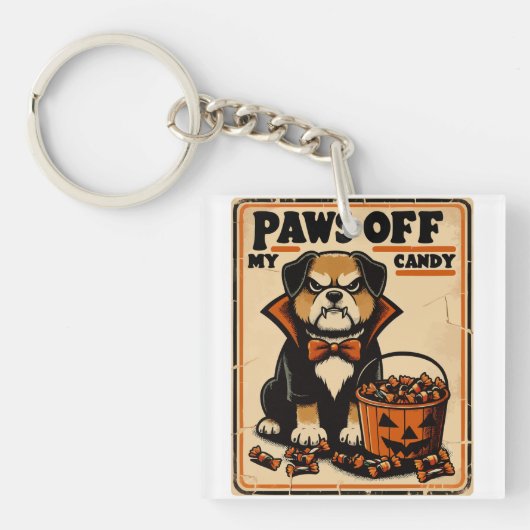 ハロウィンのお菓子を守る吸血鬼コスプレの犬 キーホルダー (正面)