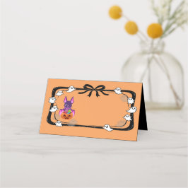ハロウィンのお菓子を持ったオレンジ色のコウモリ プレイスカード