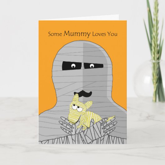 ハロウィンのかわいいミイラ犬を握っているミイラ カード (正面)