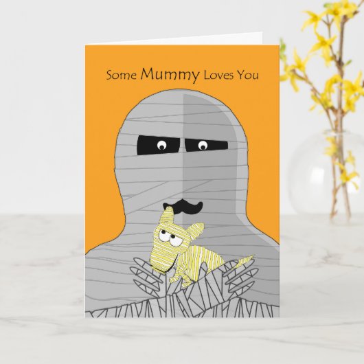 ハロウィンのかわいいミイラ犬を握っているミイラ カード (黄色い花)