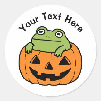 ハロウィンのカボチャの中のかわいいカエル ラウンドシール