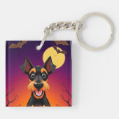 ハロウィンのシーンにいるかわいい犬 キーホルダー (裏面)