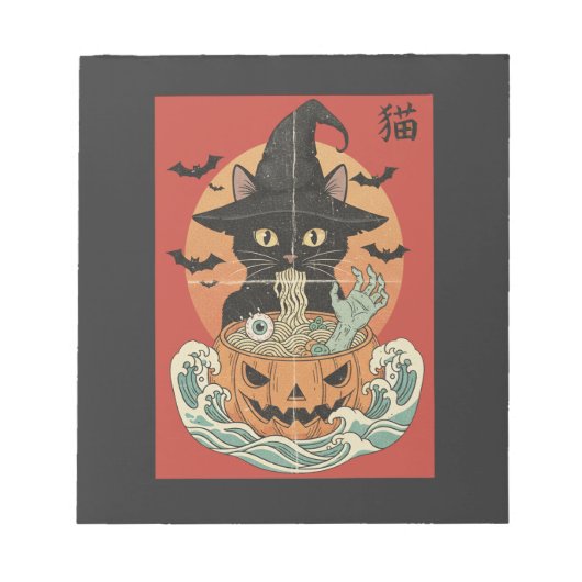 ハロウィンの時に日本のラーメンを食べる黒猫 ノートパッド (正面)