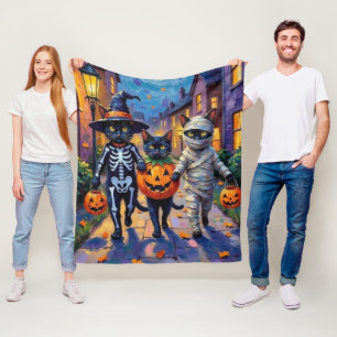 ハロウィンの衣装を着た黒猫たちがトリックオアトリート フリースブランケット