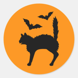 ハロウィンの驚いた猫とコウモリのシルエット オレンジ ラウンドシール