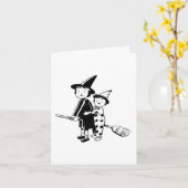 ハロウィンの魔女と道化師がほうきに乗っている カード (黄色い花)