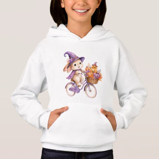 ハロウィンの魔女に扮したうさぎがカボチャの自転車に乗る  (正面)