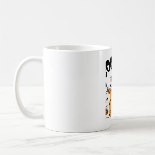 ハロウィンステッカーにおもしろいを貼った猫 コーヒーマグカップ (左)