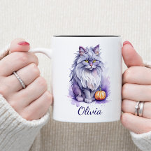 ハロウィーンの水色のアンゴラ猫とカボチャ