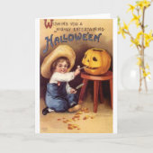 ハロウィーンを楽しむ男の子の彫刻カボチャ カード (黄色い花)