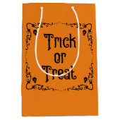 ハロウィーンカボチャのオレンジとブラックトリックまたはトリート ミディアムペーパーバッグ (正面)