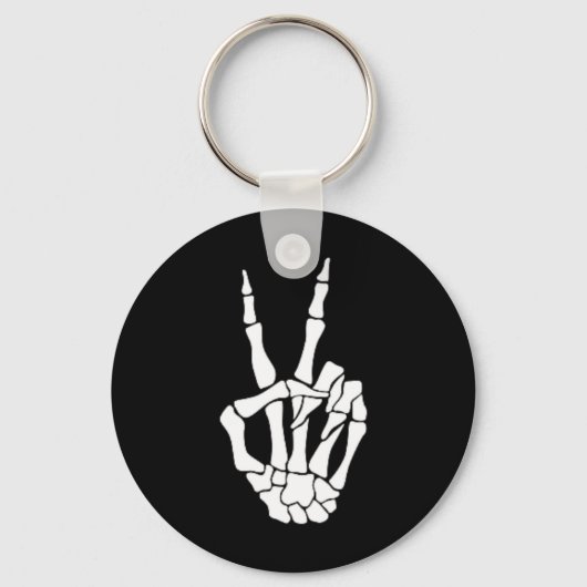 ハンドピースサインボーンハロウィンポケットのスケルトン キーホルダー (正面)