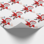 ハンマーを握り、親指を与えるサンタ ラッピングペーパー (角)