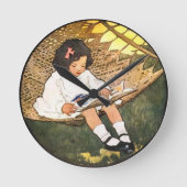ハンモックで本を読む小さな女の子 ラウンド壁時計 (正面)