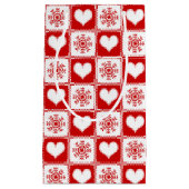 ハートおよび雪片のクリスマスパターン スモールペーパーバッグ (正面)