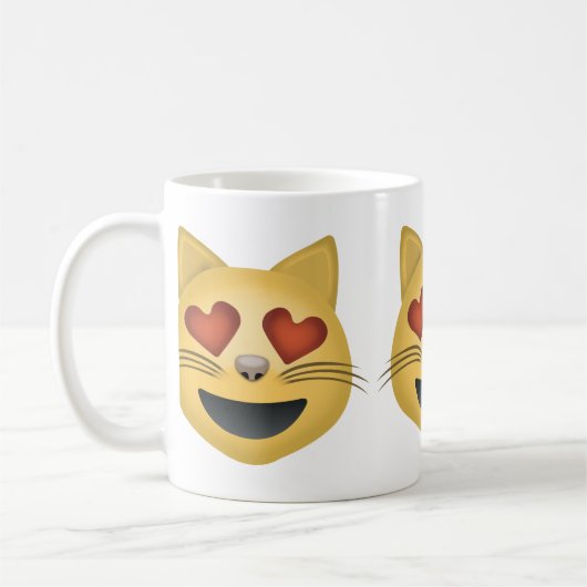 ハート形の目Emojiが付いている微笑猫の顔 コーヒーマグカップ (左)