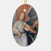 バイオリンのクリスマスのオーナメントを遊ぶヴィンテージの天使 セラミックオーナメント (左)