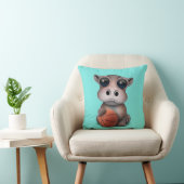 バスケットボールと遊んでいるかわいいベビーのカバ クッション (椅子)