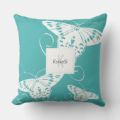 バタフライパターンティール（緑がかった色）及び白色 クッション (正面)