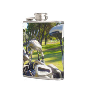 バッグフルゴルフクラブ、ビニル包まれたスキットル フラスク (左)