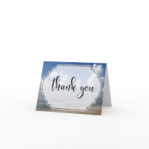 バッジ付きビーチ写真上の太雲ありがとう