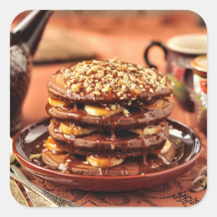バナナおよびカラメルが付いているチョコレートパンケーキ スクエアシール