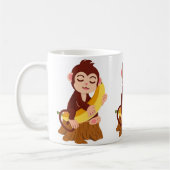 バナナを持つサルのかわいいキャラクター コーヒーマグカップ (左)