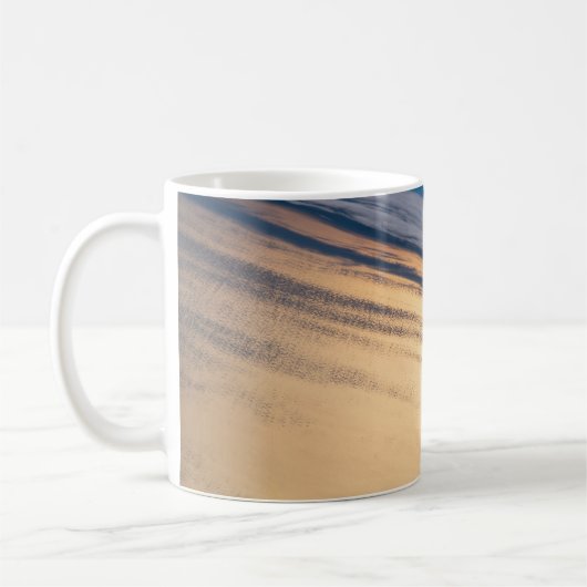 バハ・カリフォルニアの海岸沖の公転の夕日 コーヒーマグカップ (左)