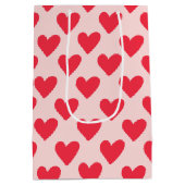 バレンタインの赤とピンクのハートパターン ミディアムペーパーバッグ (裏面)