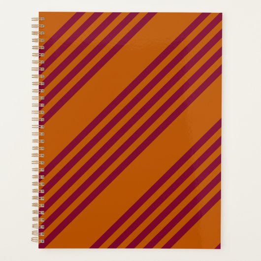 バーガンディ赤と燃えたオレンジの5つのストライプパターン。 プランナー手帳 (正面)