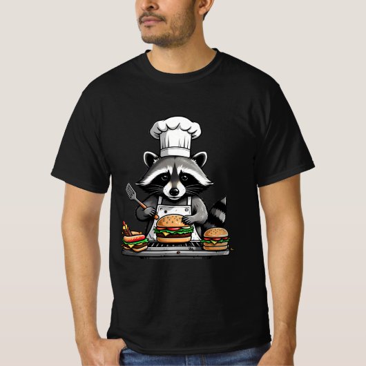 バーベキューでバンズをひっくり返す面白いアライグマ Tシャツ (正面)