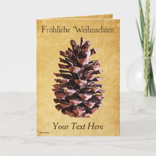 パインコーンオンヴィンテージ紙- Frehliche Weihnachen カード (正面)