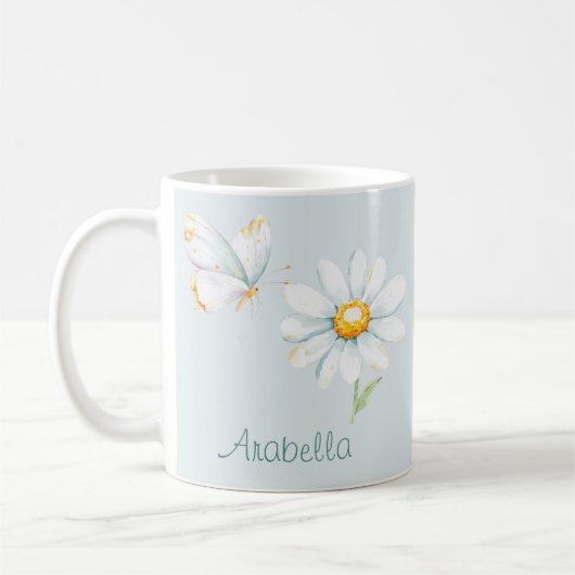 パステルカラーの水彩画風の蝶とデイジー コーヒーマグカップ (左)