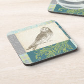 パターンの背景に灰色のフクロウ コースター (左側)