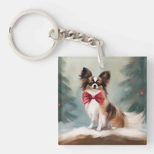 パピヨンの犬の雪のクリスマス キーホルダー (正面)